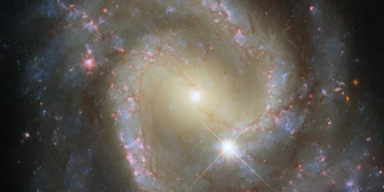 Hubble Spots Isolated Barred Spiral Galaxy That’s Secretly Part of a Cosmic Duo