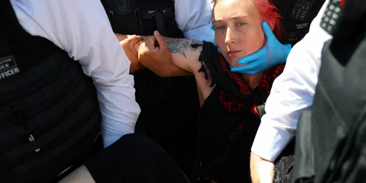 After ban, UK detains dozens of Palestinian protest group members